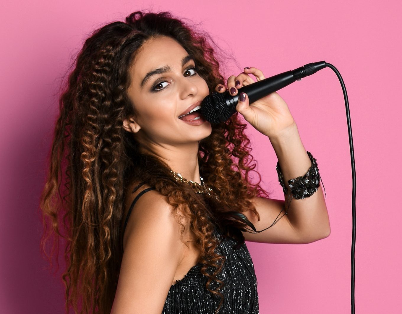 Female Rockstar Singing With Microphone