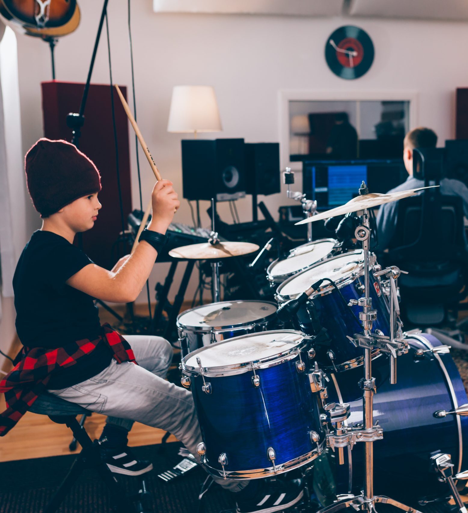 kids rock band playing in music studio